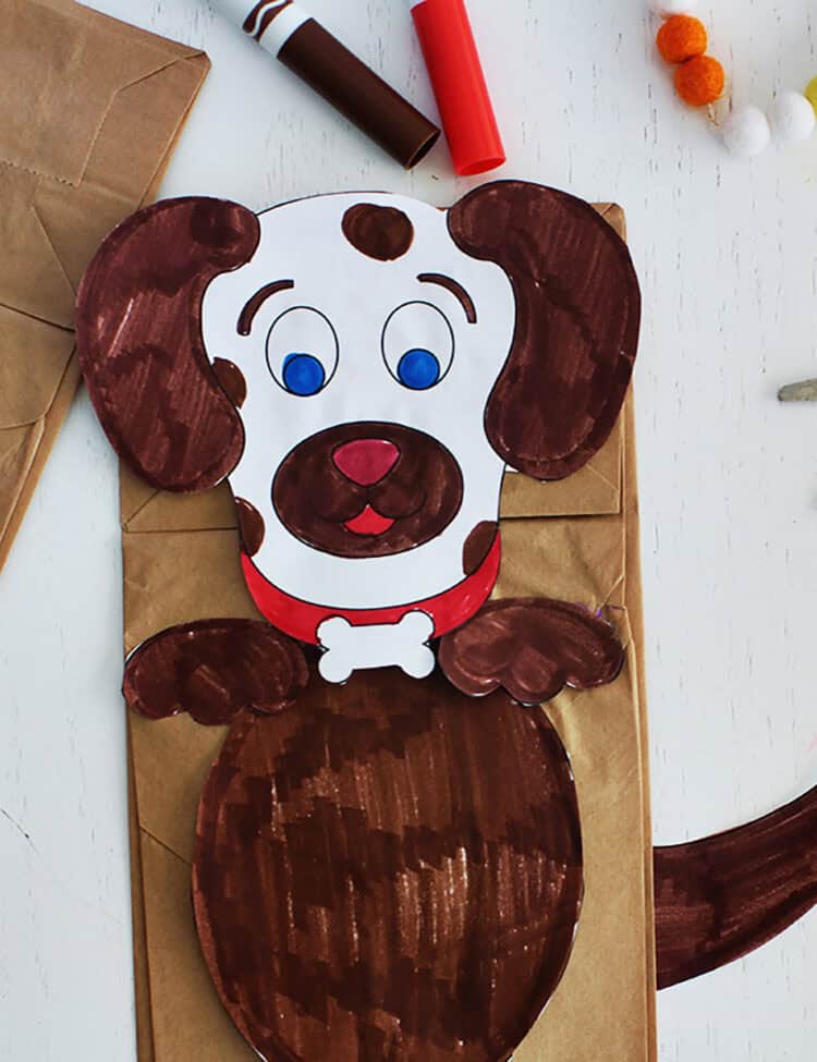 Paper bag puppet made to look like a dog.