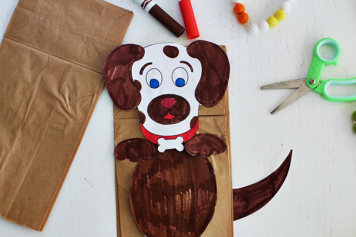 Paper bag puppet made to look like a dog.