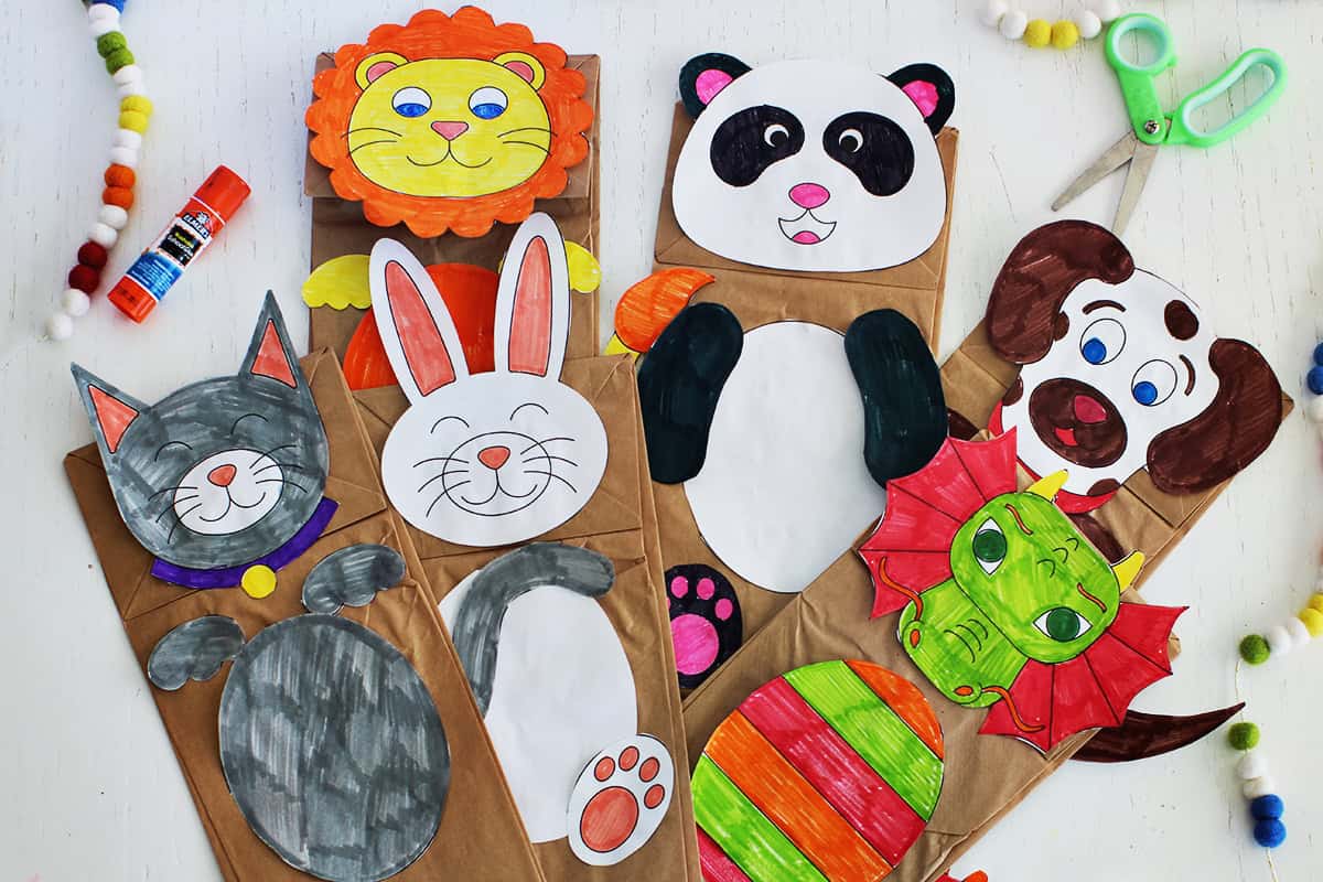 Paper puppets made to look like a lion, panda, rabbit, cat, dog and dragon.