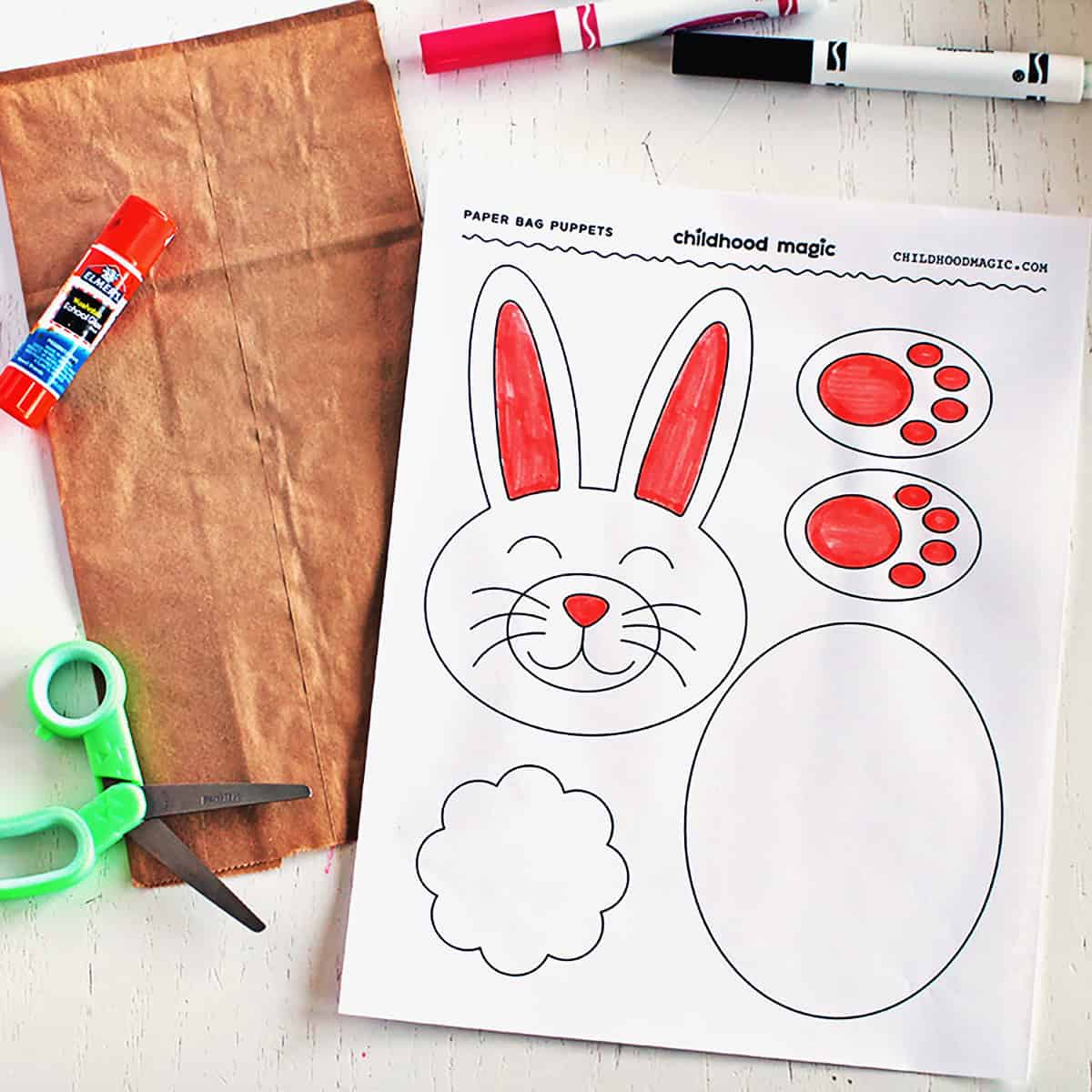 Paper with rabbit head, paws, tail and belly ready to cut out and make into a paper bag puppet.