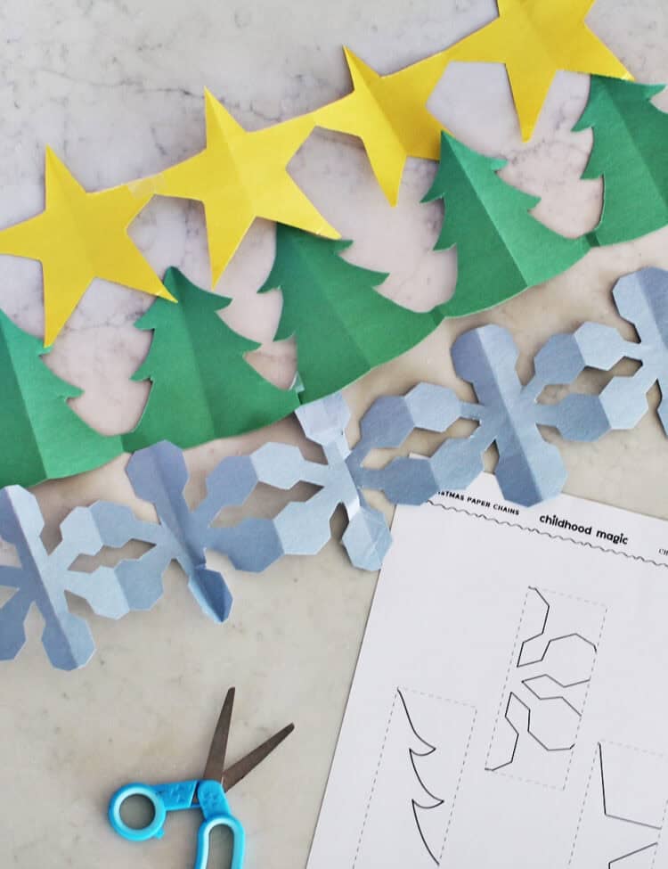 Paper chains shaped likes stars, trees and snowflakes.