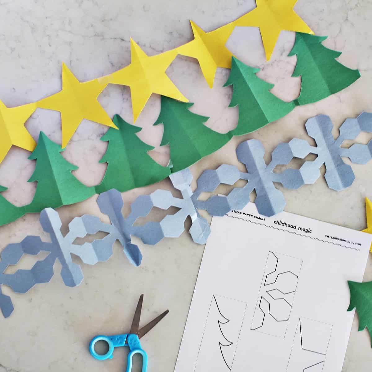 Paper chains shaped likes stars, trees and snowflakes.