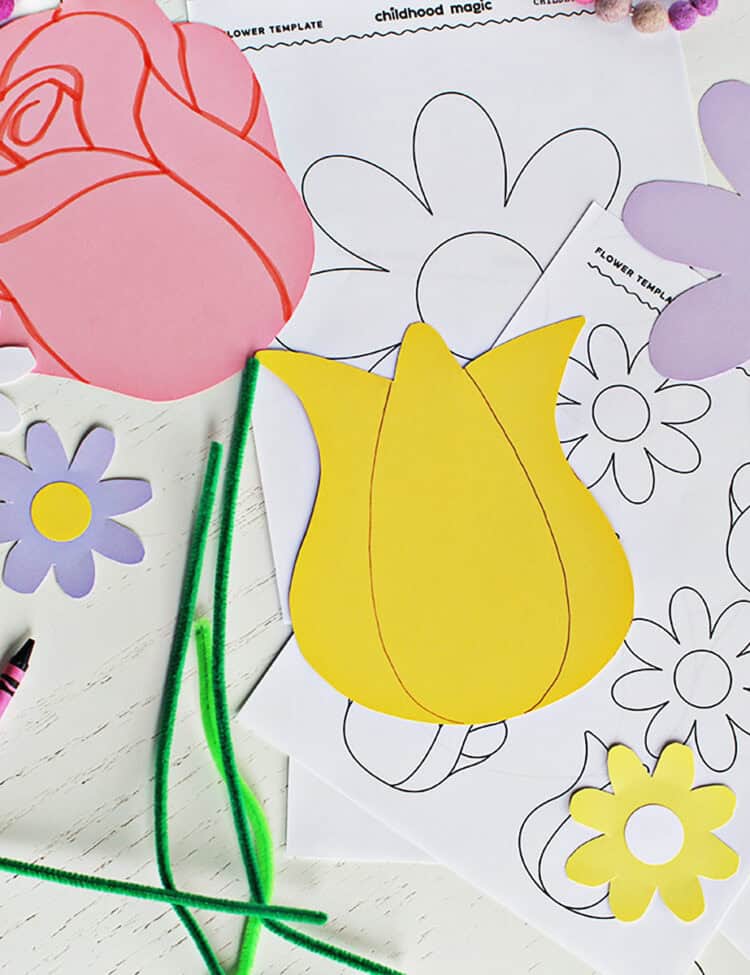 cut out flowers from paper on top of printed flower templates.