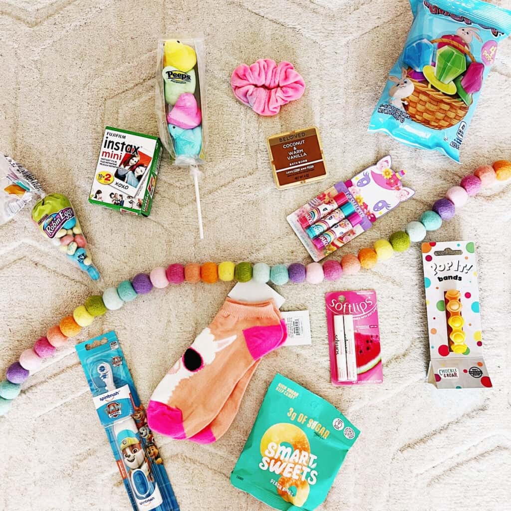 Easter snacks, candy and toys on the floor.