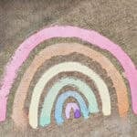 chalk paint rainbow on cement.