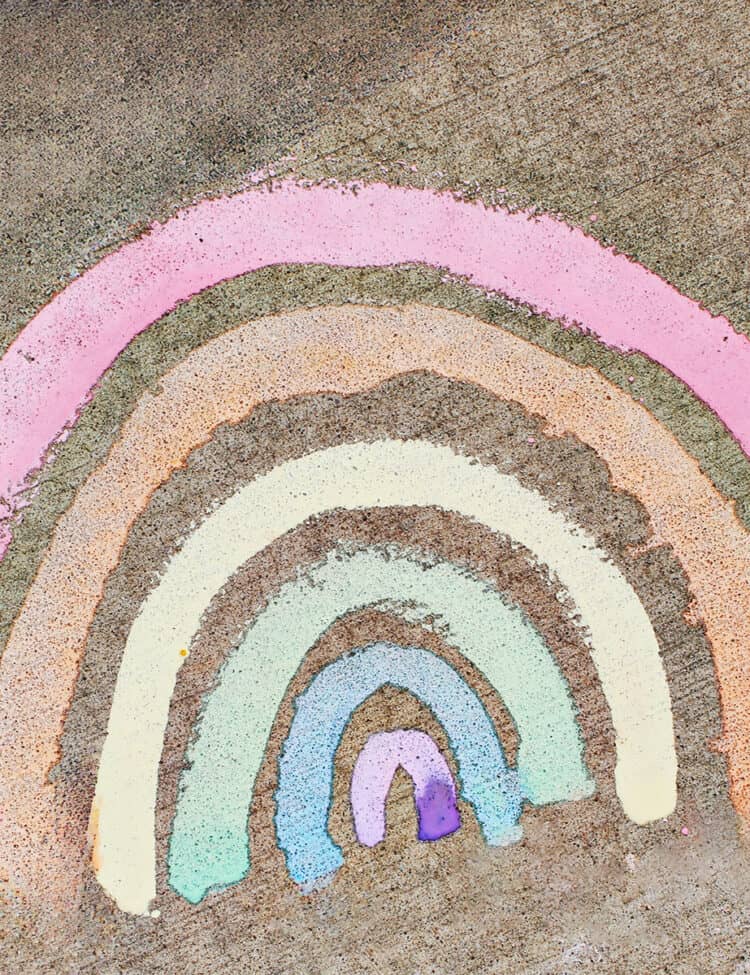 chalk paint rainbow on cement.
