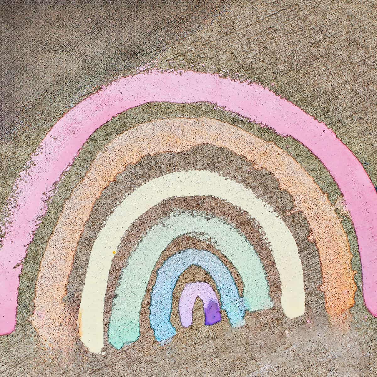 chalk paint rainbow on cement.