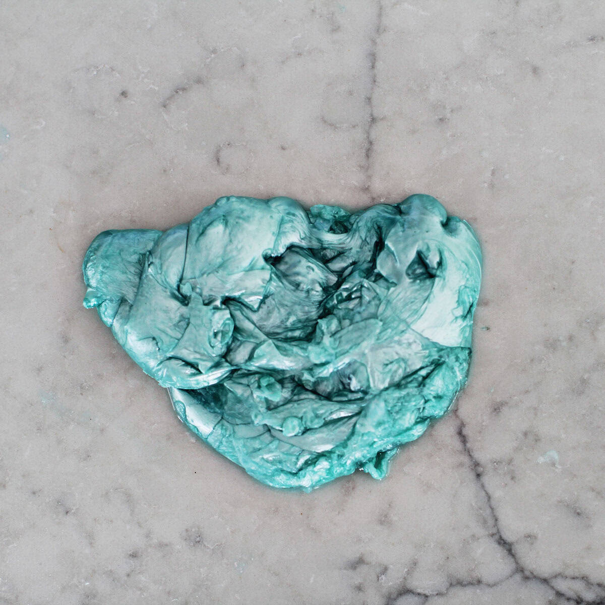 metallic blue slime on a counter.