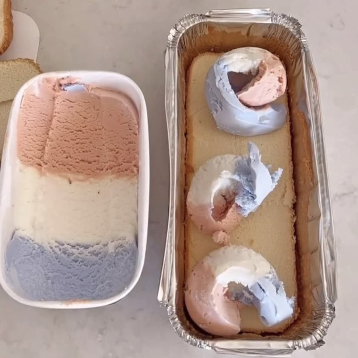 three scoops of red, white and blue ice cream stacked on a layer of pound cake next to the container of ice cream.