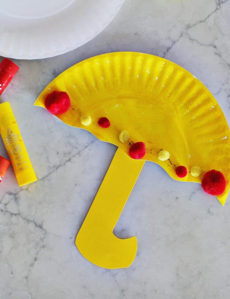 Cardstock glued to half of yellow paper plate painted yellow.