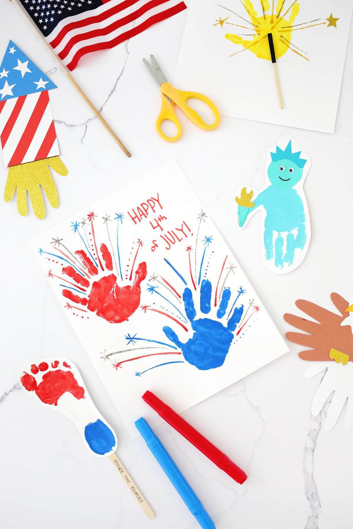 Fourth of July handprint crafts on a counter.