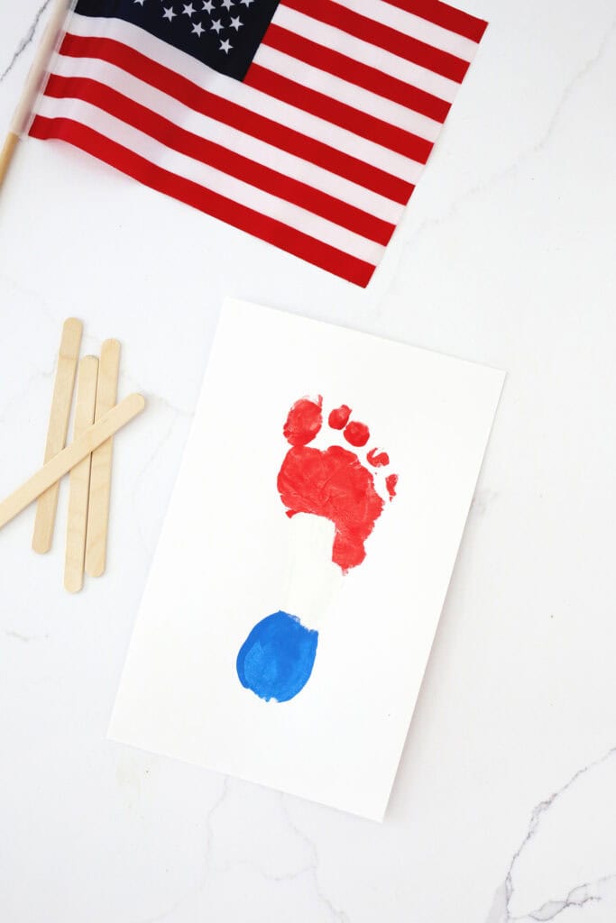 a footprint print mae with red, white and blue paint to look like a popsicle.