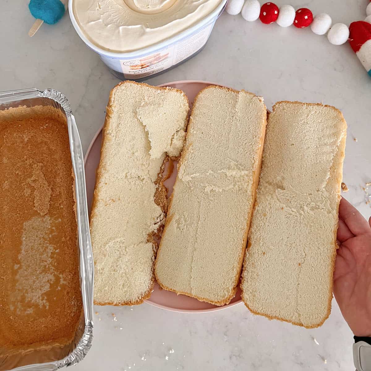 A pound cake cut into thirds length-wise.