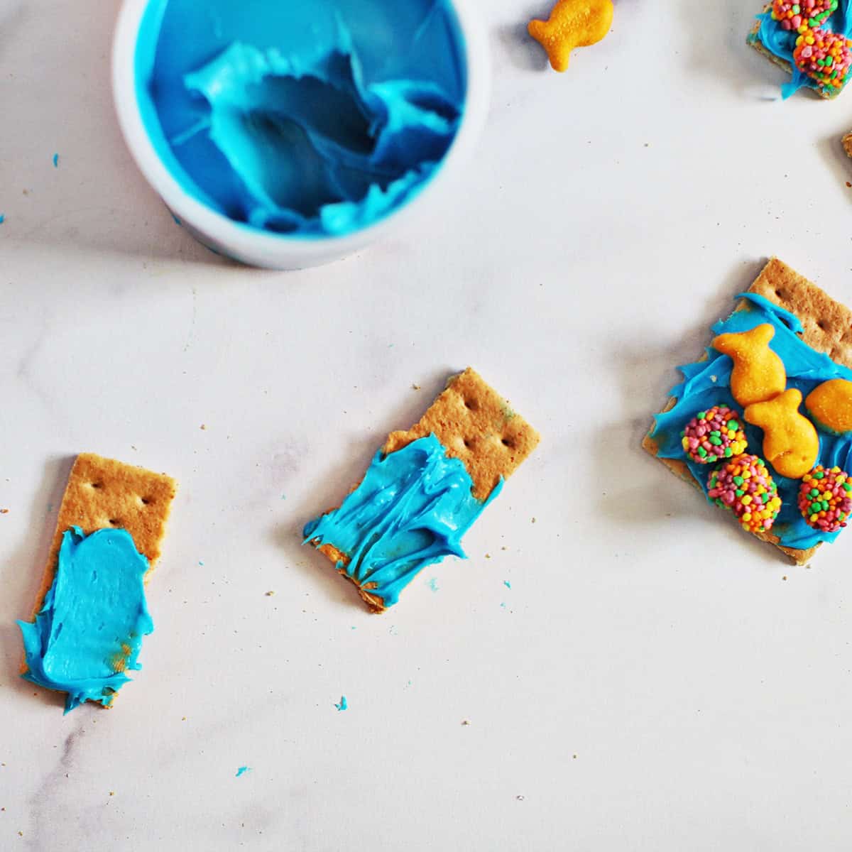 Blue frosting on a graham cracker.