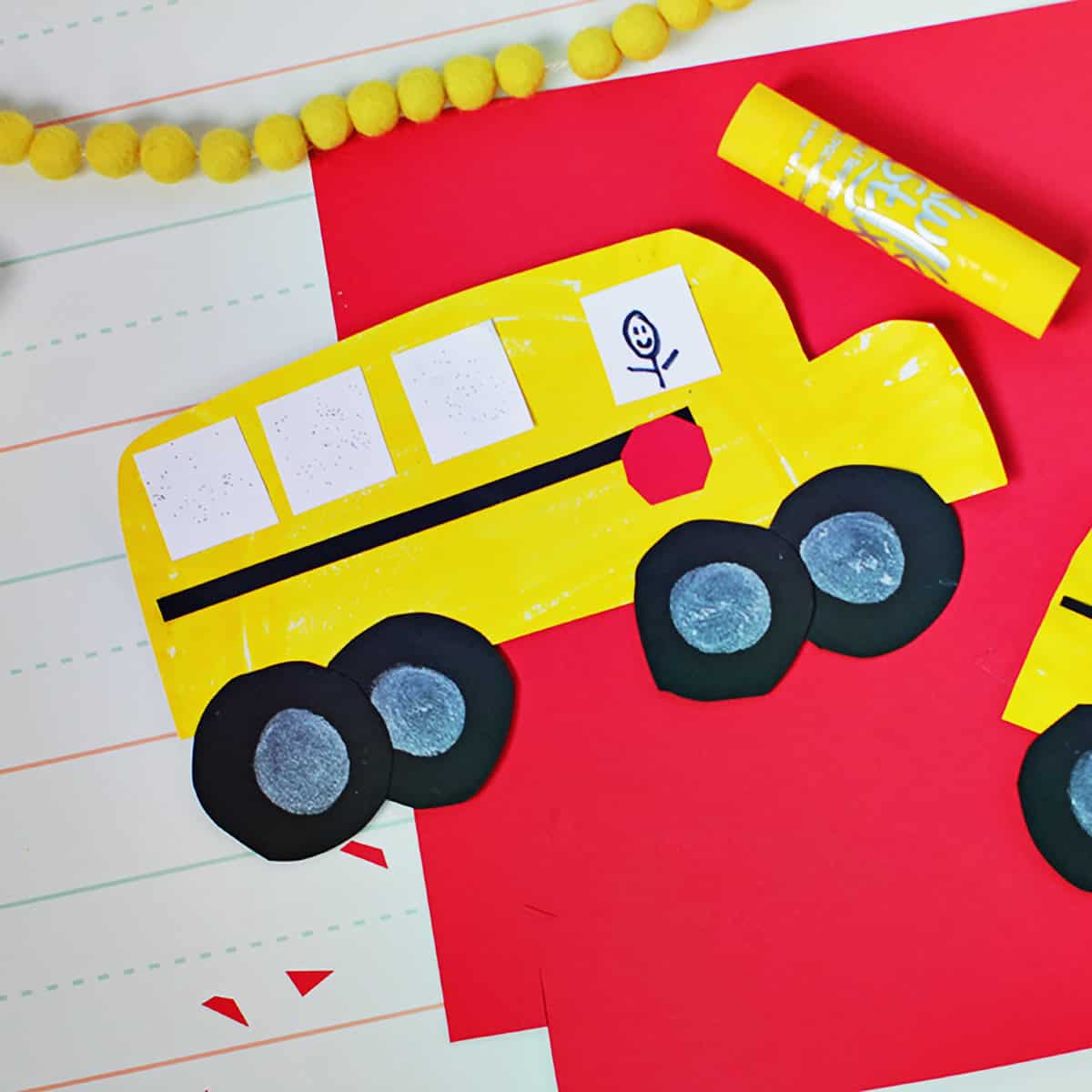 paper plate painted yellow and cut out to look like a school bus.