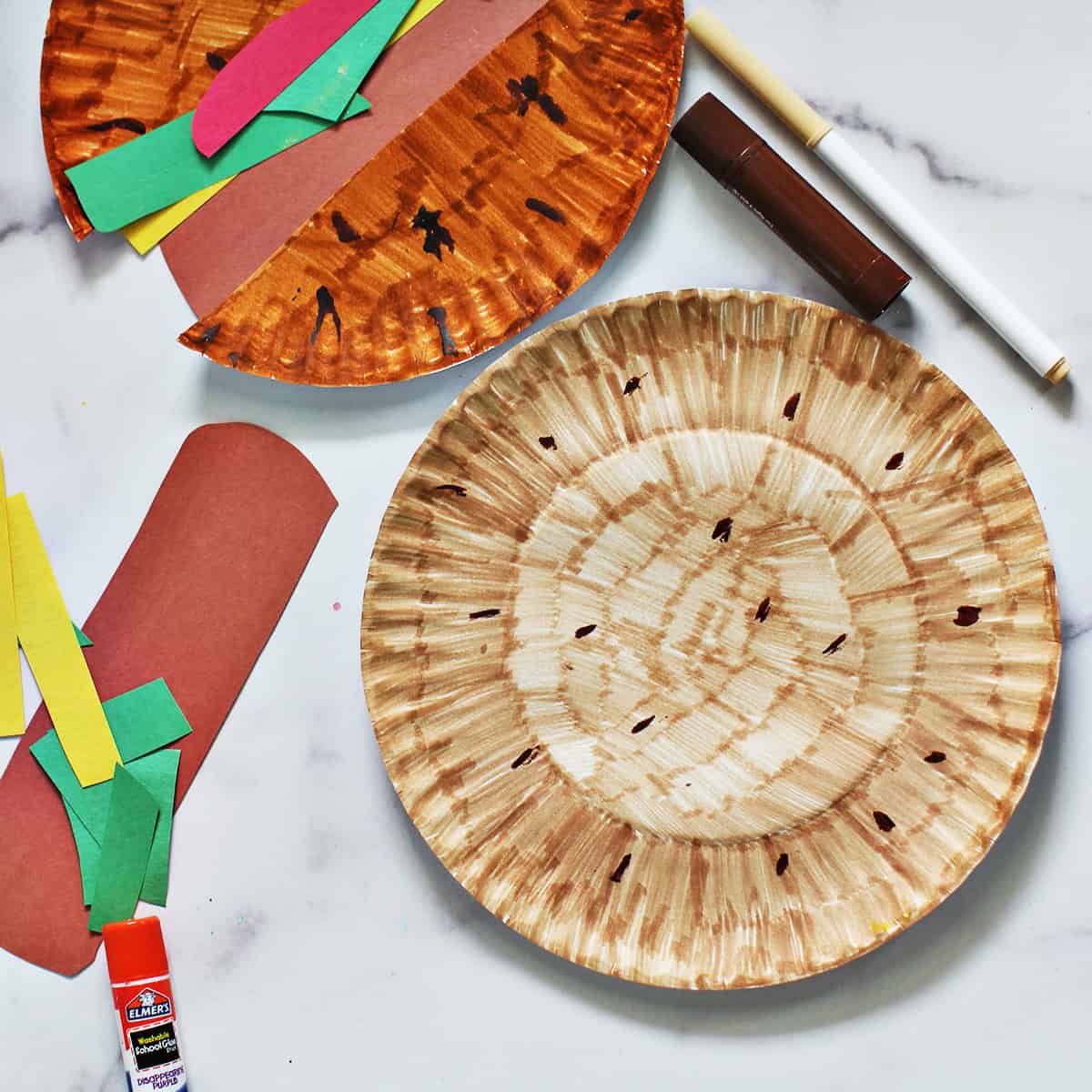 Paper plate colored tan and brown.