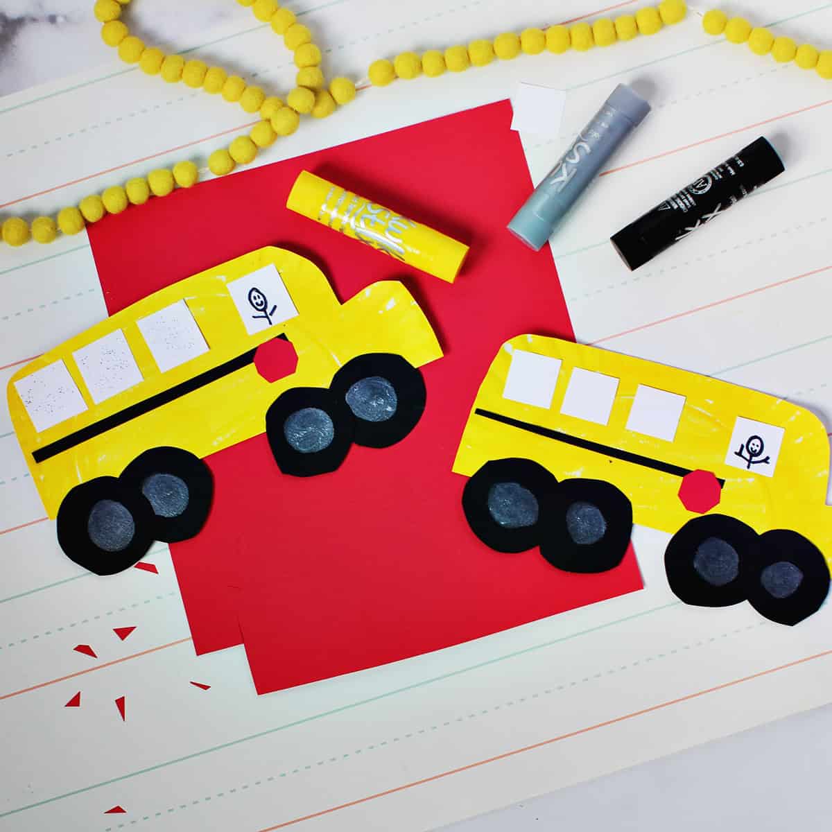 paper plate painted yellow and cut out to look like a school bus.