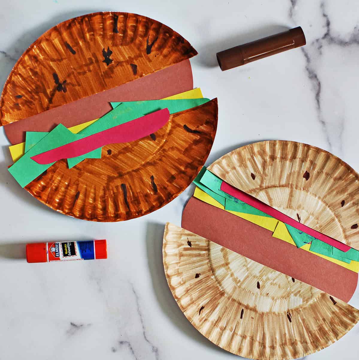paper plates and construction paper glued together to look like hamburgers.