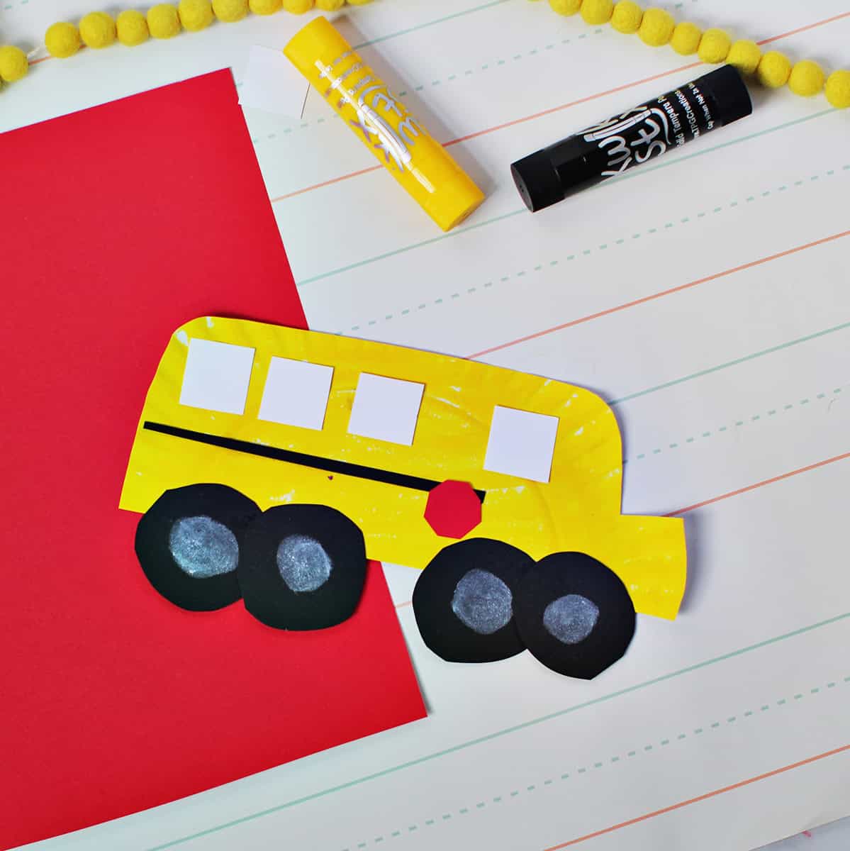 paper plate painted yellow and cut out to look like a school bus.