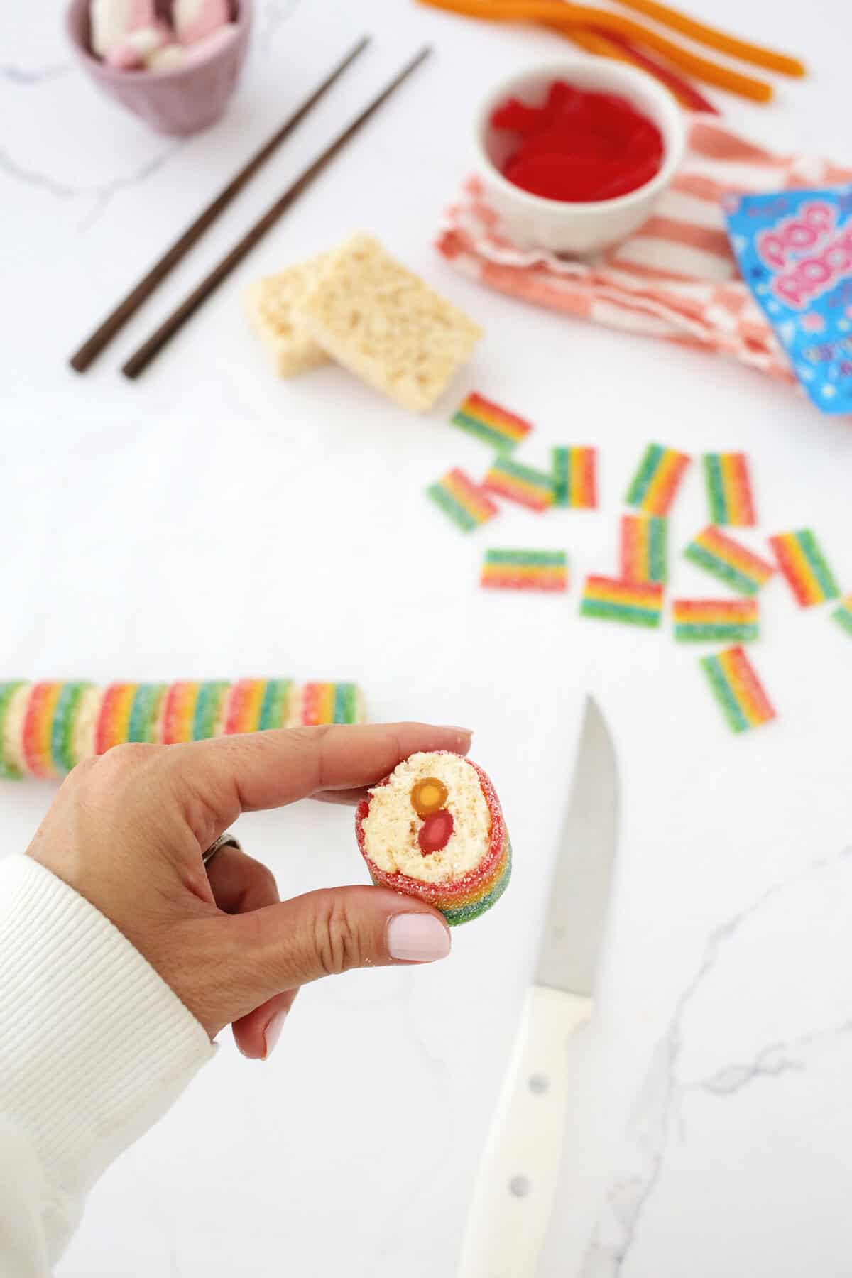 sushi candy roll being held so middle is visible.