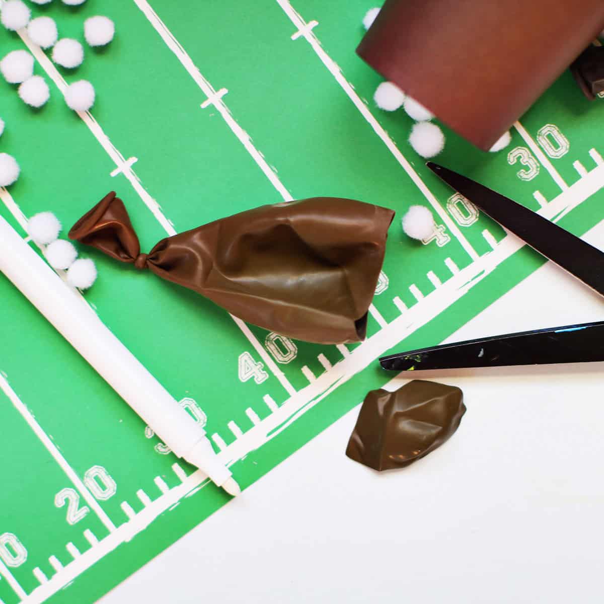a Brown balloon that has been tied with the top cut off.