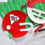 paper plates cut out and decorated to look like helmets for the Kansas City chiefs.