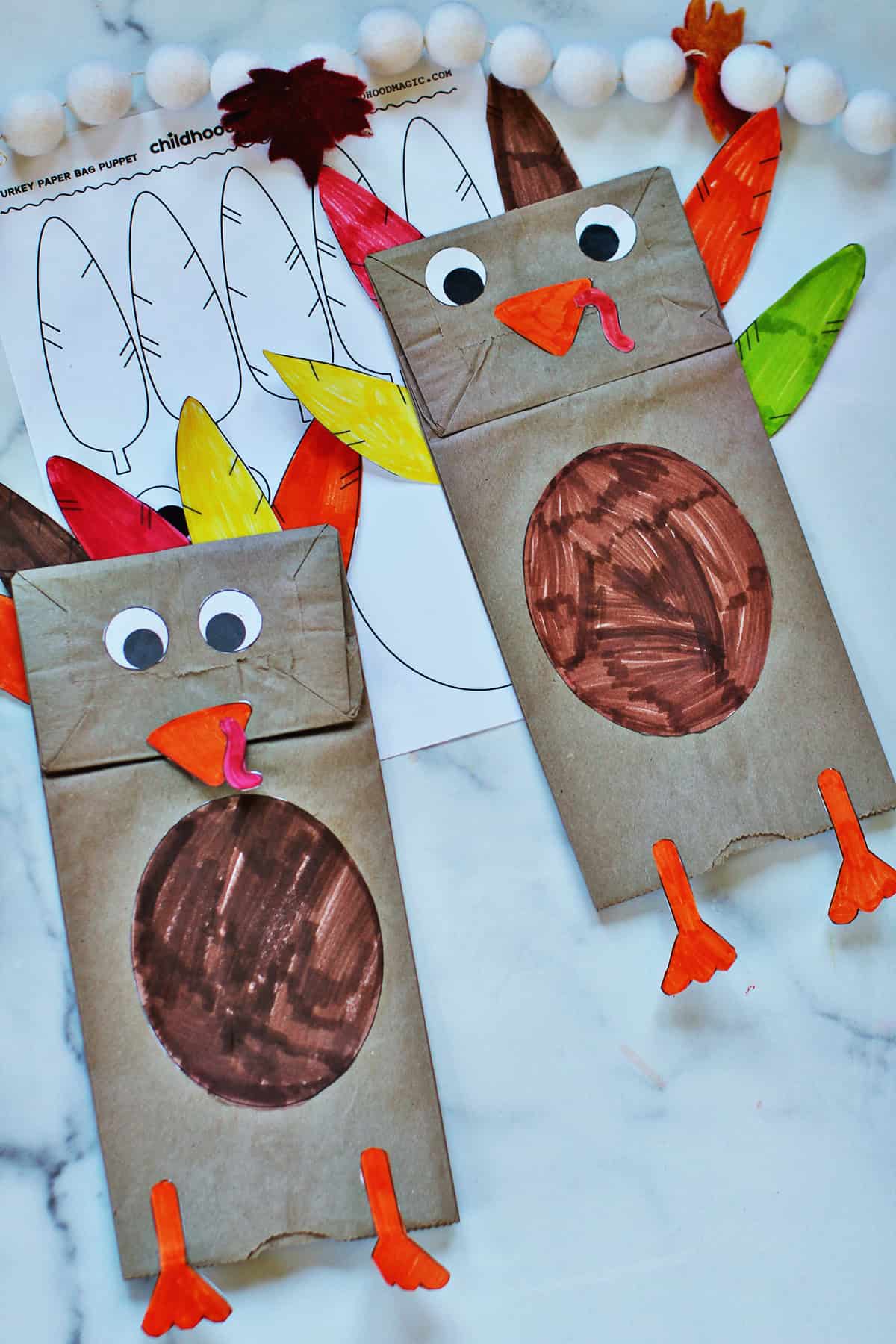paper lunch bags decorated to look like turkeys.